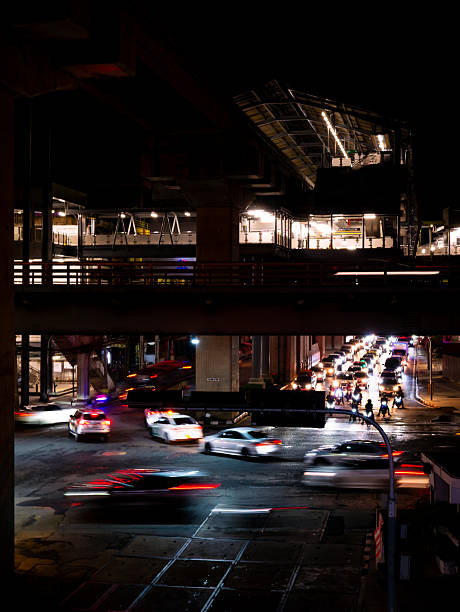 Complex Urban Infrastructure at Night - Multi-Level Highway Interchange with Light Trails and Concrete Pillars