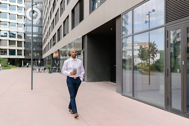 istock Man enjoying coffee while strolling in the city 2236694029