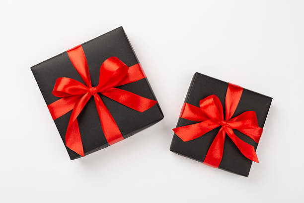 istock Black gift boxes on color background, top view. Black Friday concept 2236694084