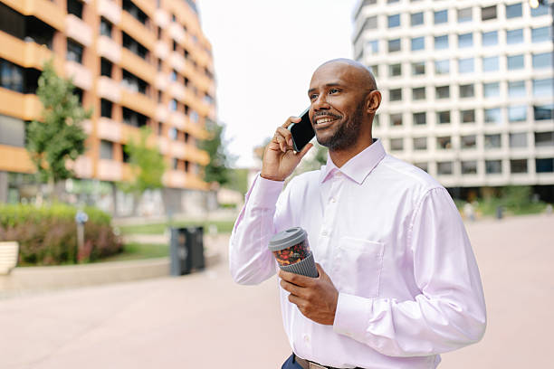 istock Man communicating on phone in vibrant city setting 2236694293
