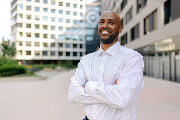 istock Man in white shirt posing confidently outdoors 2236694754