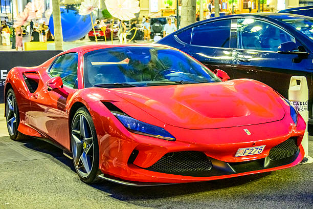 Ferrari F8 Spider parked on the Casino square in Monte Carlo in Monaco during a summer evening. The F8 Spider is an open-top variant of the F8 Tributo
