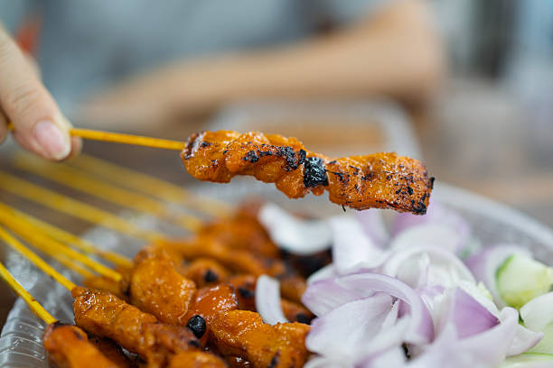 istock Malaysian chicken satay with peanut sauce and vegetables 2236697086
