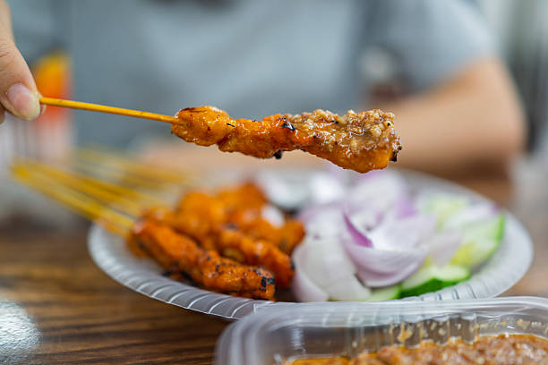 istock Malaysian chicken satay with peanut sauce and vegetables 2236697387