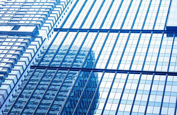 istock Low shot of visual dynamics of modern glass building background 2236700584