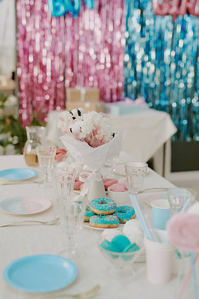 istock Decorated Table Displaying Sweets and Drinks at Gender Reveal Party Celebration 2236702884