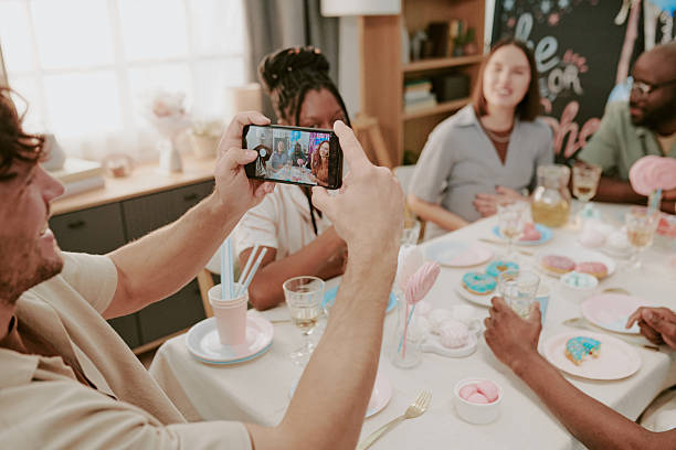 istock Multiethnic Young Adults Smiling and Taking Group Selfie during Celebration 2236702994