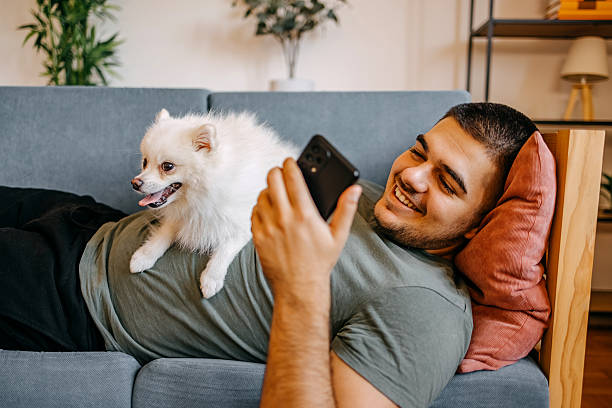 istock Young man spending time at home with his dog 2236704395