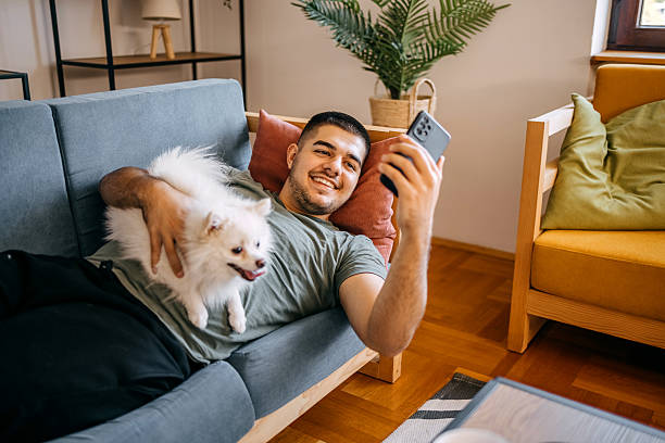 istock Young man spending time at home with his dog 2236704417