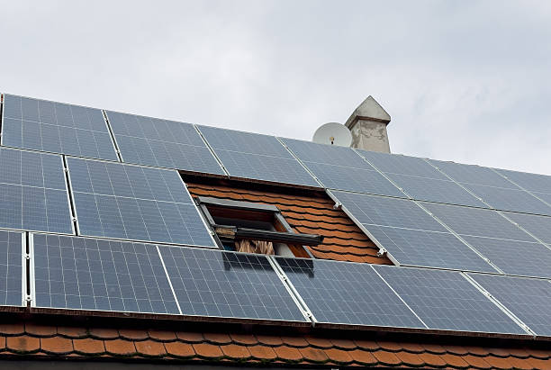 istock solar panels on roof with skylight 2236708578