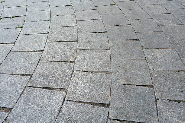 istock gray stone or tiles road, a beautiful background for the designer with empty space 2236710626