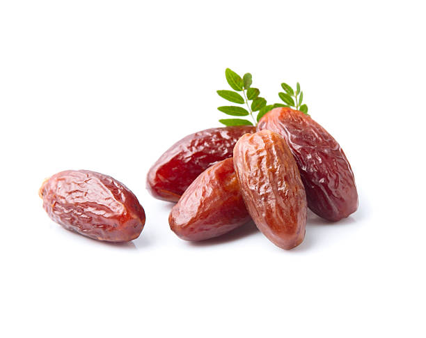 istock Dried dates fruits with leaves 2236710944