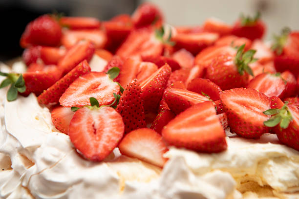 Close-up of strawberries on top of a pavlova