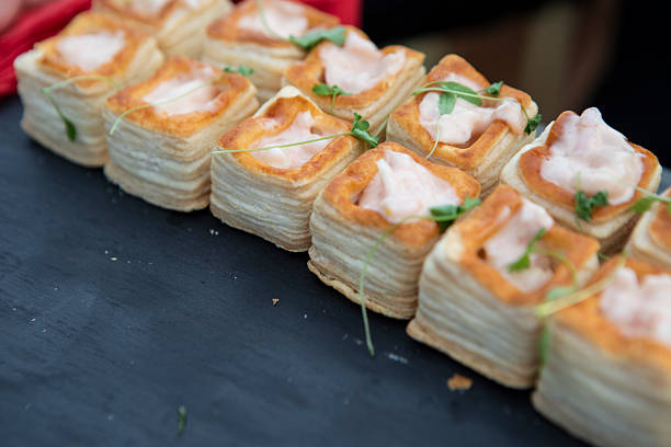 Savoury appetisers on a slate tray at an outdoor party