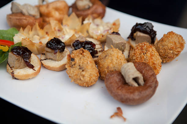 Mixed canapes and savoury appetisers at an outdoor party