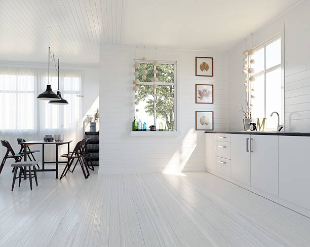 istock Modern Scandinavian kitchen and dining room interior. Bright white space with wood floors and natural light from windows. 3D rendering. 2236714350