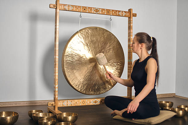 istock Meditative gong session with singing bowls in calm atmosphere 2236714457