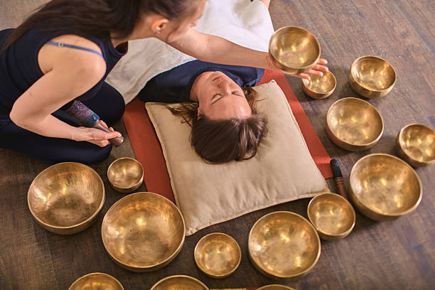 istock Sound healing with singing bowls in calming ambiance 2236714551