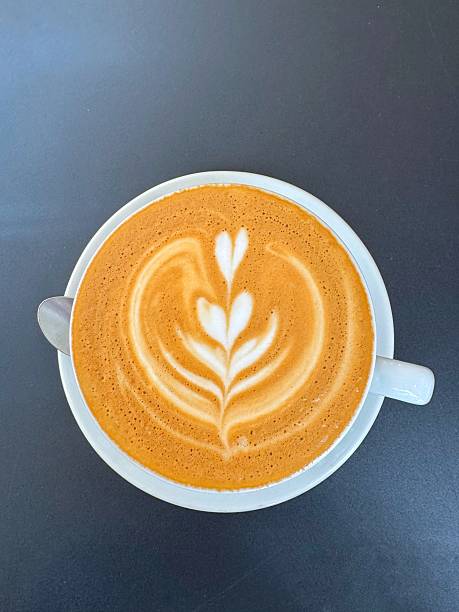 istock Flat white with tulip froth art and metal spoon 2236715603