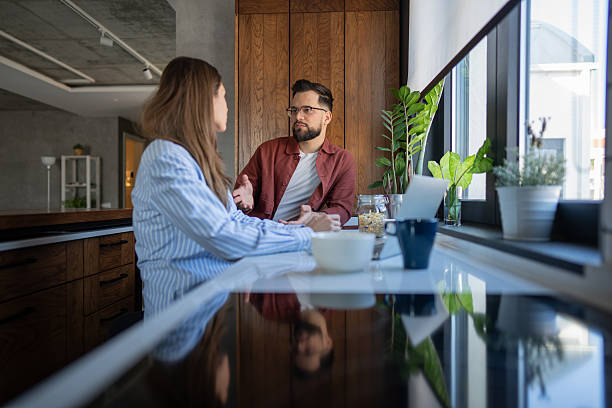 istock Couple having a serious conversation at breakfast in kitchen 2236717664