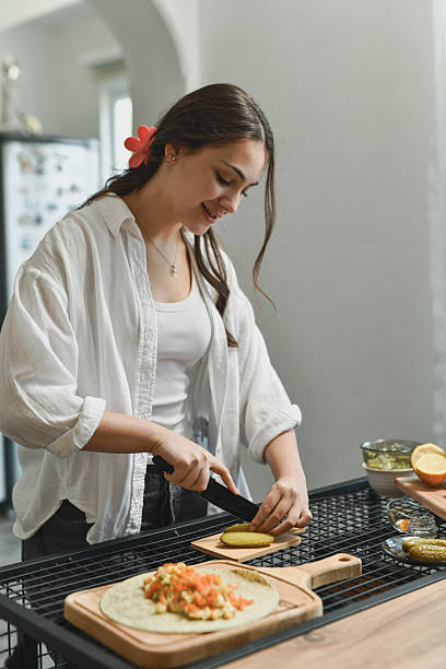 istock Focused Female Slicing Pickles With Care And Enjoyment 2236718809