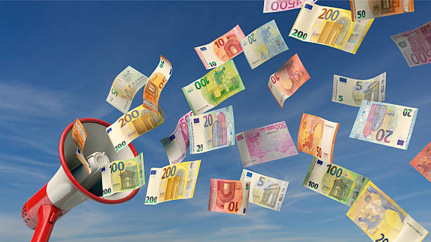 istock Winning announcement - Megaphone sprays Euro notes 2236721069
