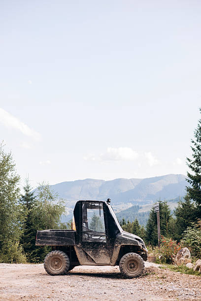 istock Off road utility vehicle on mountain trail with scenic forest view. 2236721666