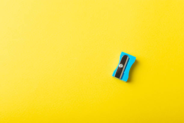 istock Pencil sharpener on bright colored background. Pencil and pencil shavings. Stationery. School supplies. School products. Flat lay. Place for text. copy space. 2236722046
