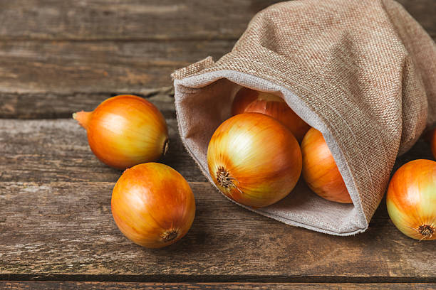istock Onion on the kitchen table. onion slice. onion rings. Fresh Yellow Onion. Natural, fresh, vegetarian food. Agricultural products. Healthy eating. Vegetables. Farmer's market. Space for text.Copy space 2236722192