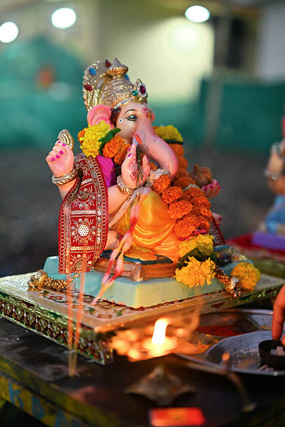istock Ganesha Idol with Aarti Flame Before Visarjan 2236722315