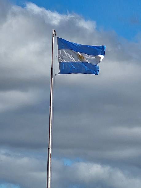 istock Argentine flag in a cloudy sky 2236724139