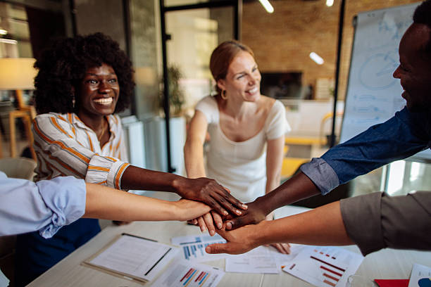 istock Diverse Team Collaborating and Celebrating Success at a Modern Office Workspace 2236724352