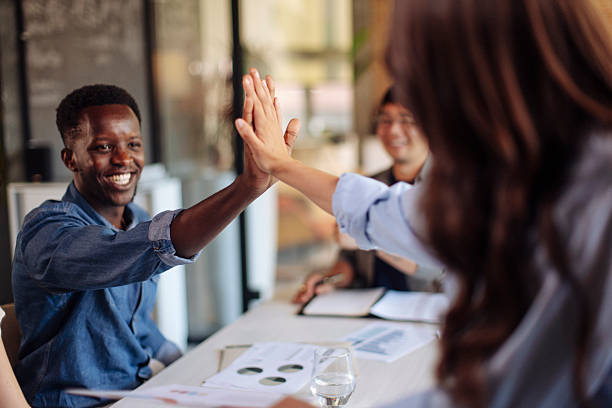 istock Team Members Celebrating Success with an Enthusiastic High Five 2236724380