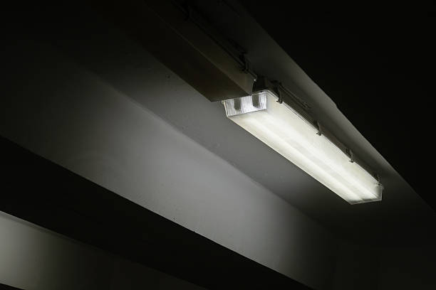 istock Fluorescent ceiling lamp glowing in the dark in underpass. 2236725590