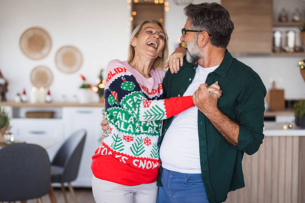 istock Senior couple dancing and laughing during christmas holidays 2236726996