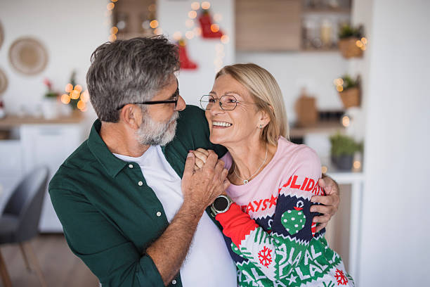 istock Senior couple sharing a loving hug during christmas holidays 2236727047