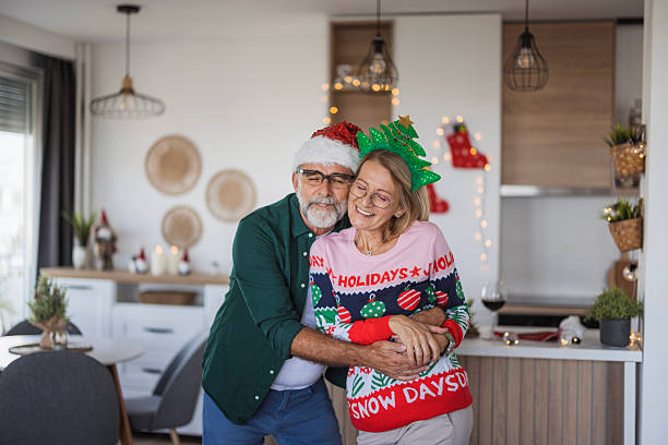 istock Senior couple hugging, celebrating christmas at home 2236727264