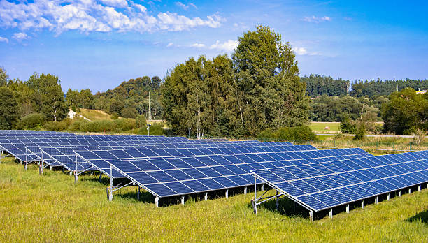istock Rows of solar panels in a solar power plant 2236730858
