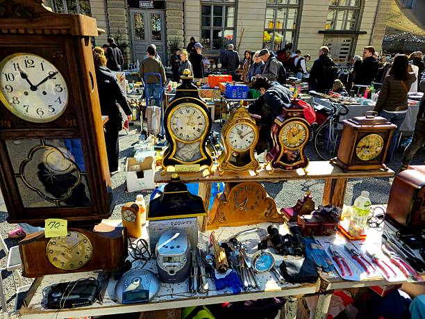 The Flea Market Kanzlei in Zurich is one of two big Second Hand Marked in Town. It is located in the 4th District next to the Helvetia Square. The Market is opened every Saturday. The image show several several people at the market captured during spring season.