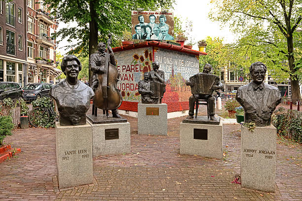 Amsterdam, Netherlands - October 6, 2014: Famous of Amsterdam musicians statues in Johnny Jordaanplein at corner of Prinsengracht and Elandsgracht