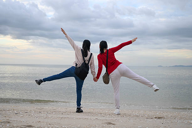 istock Joyful Journey: Two Friends Exploring the Shoreline 2236734450