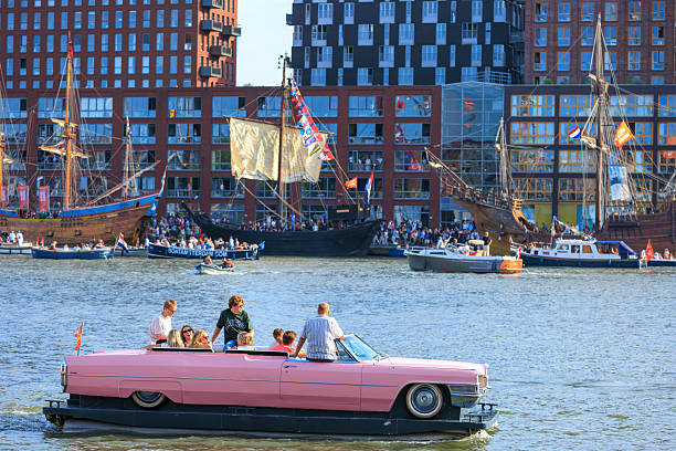 Amsterdam, Netherlands—Aug 24, 2025:  a ship decorated as a vintage convertible cruising during Sail Amsterdam 2025