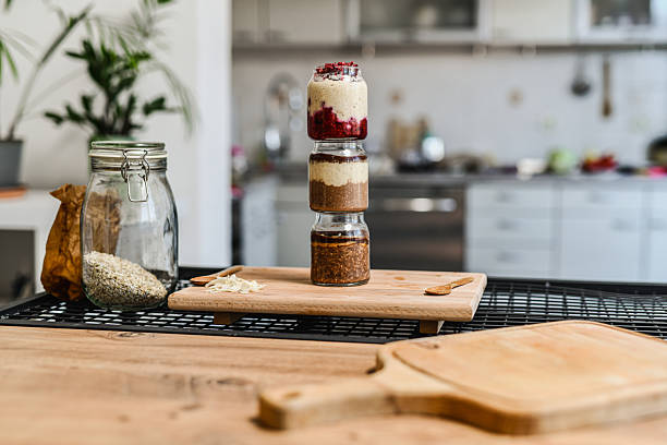 Colorful Overnight Oats In Transparent Jars Arranged Vertically Showing Layered Ingredients