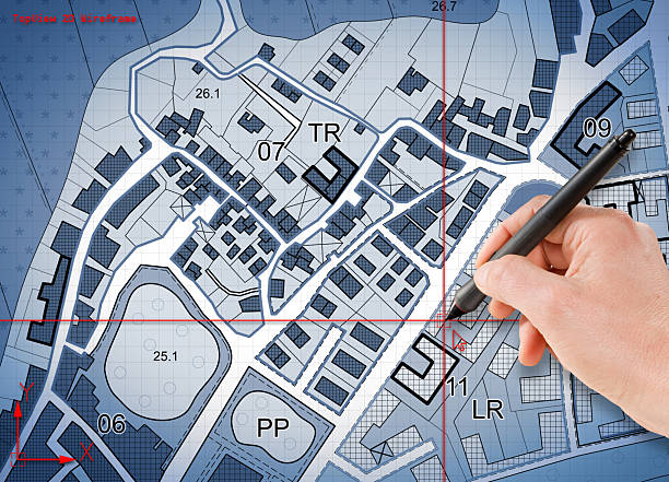istock Architect drawing with a digital pen and CAD software Computer-Aided-Design a new residential building over an imaginary cadastral map of territory 2236736724