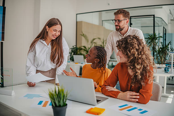 istock Young professionals collaborate and share ideas in a modern startup office environment 2236738878