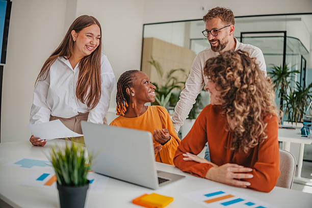istock Young professionals collaborate and share ideas in a vibrant startup office setting 2236738984
