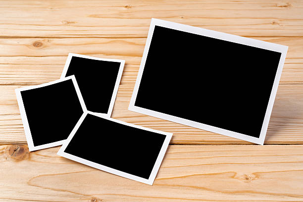 istock Blank photo frames for your photos on wooden background 2236739078