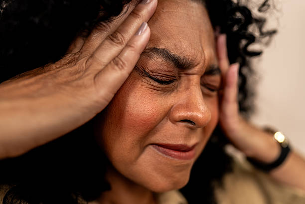 istock Mature woman with a headache in a studio shot 2236739094