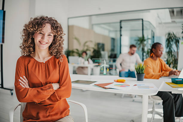 istock Young professionals collaborate at a vibrant startup office while sharing ideas and enjoying their work environment 2236739108