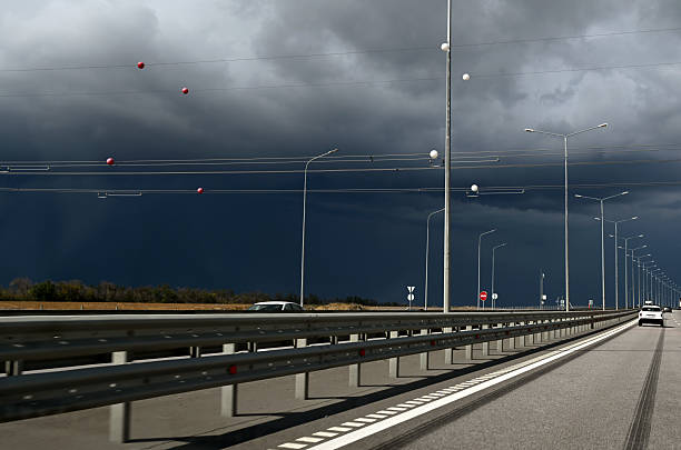 view of storm clouds and rain over the highway